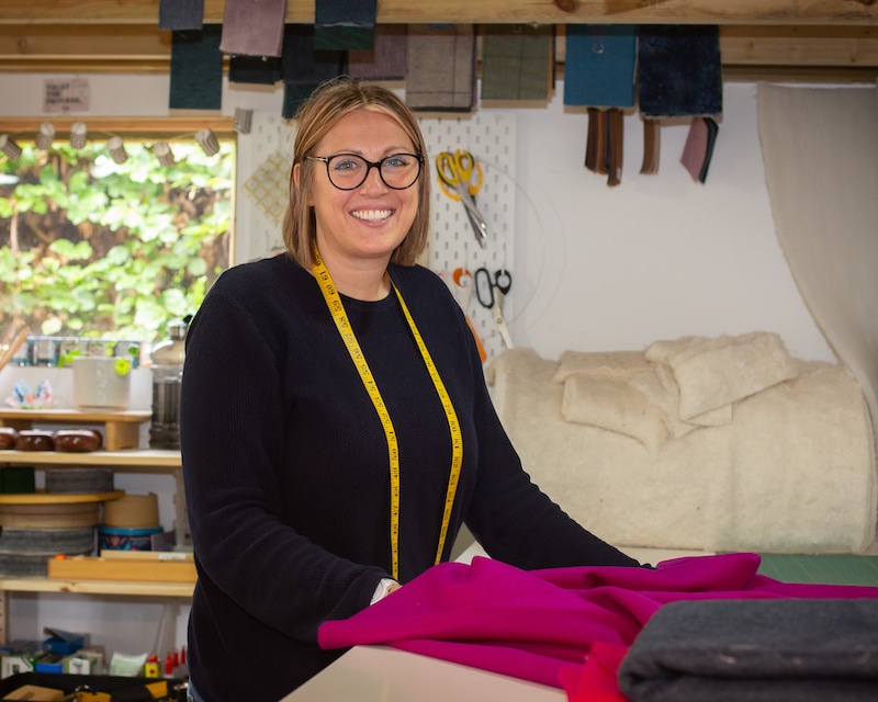 Kate in studio with measuring tape