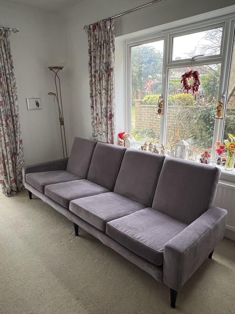 Stylishly designed RETRO 4 SEATER SOFA in soft grey fabric, perfect for enhancing your living space with comfort and elegance.