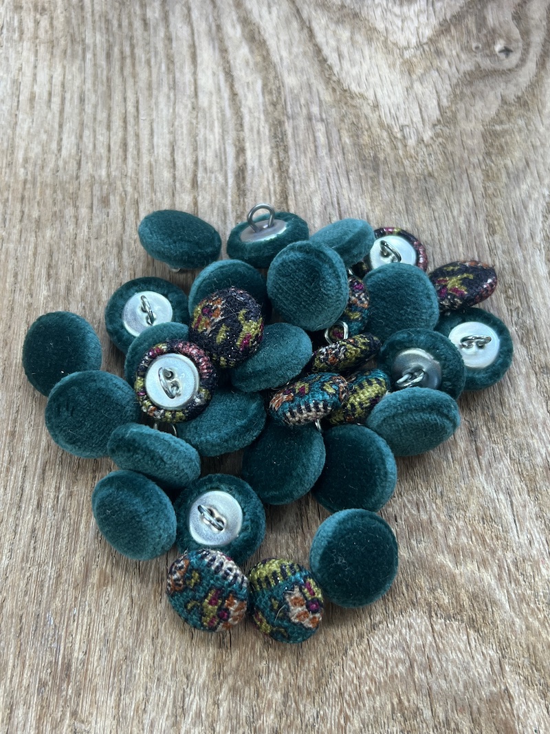 A stylish assortment of textured green and patterned buttons, perfect for enhancing your sewing or crafting projects.