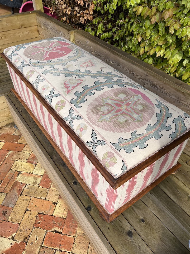 Stylish bespoke large ottoman box featuring intricate fabric design and a sturdy wooden base, perfect for storage and decor.